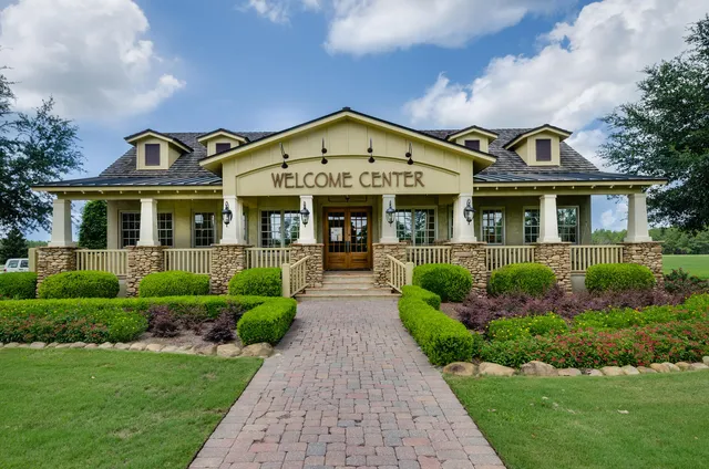 a view of a backyard with swimming pool