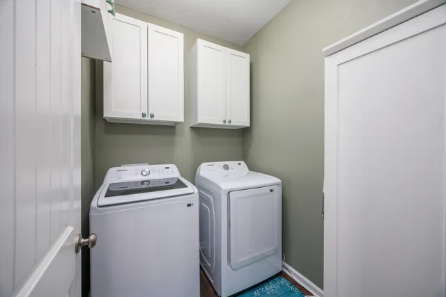 a dining room with furniture window and wooden floor