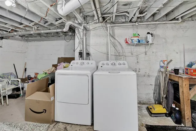 a view of backyard with wooden fence and large trees