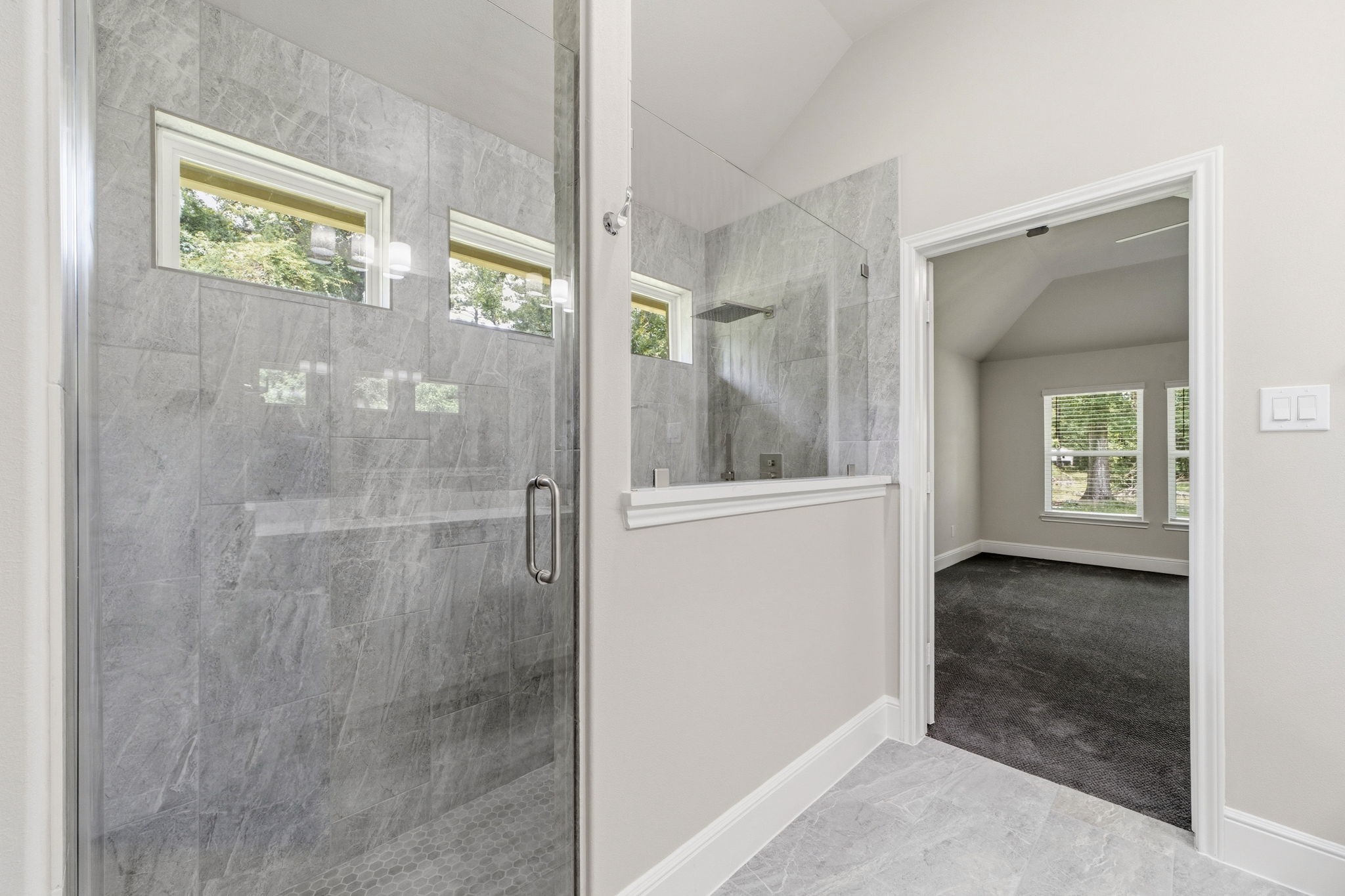 23620 Youpon Lane Spring, TX 77389 - Photo 24 of 37 Luxurious walk in shower with elegant tile surround and sleek glass enclosure