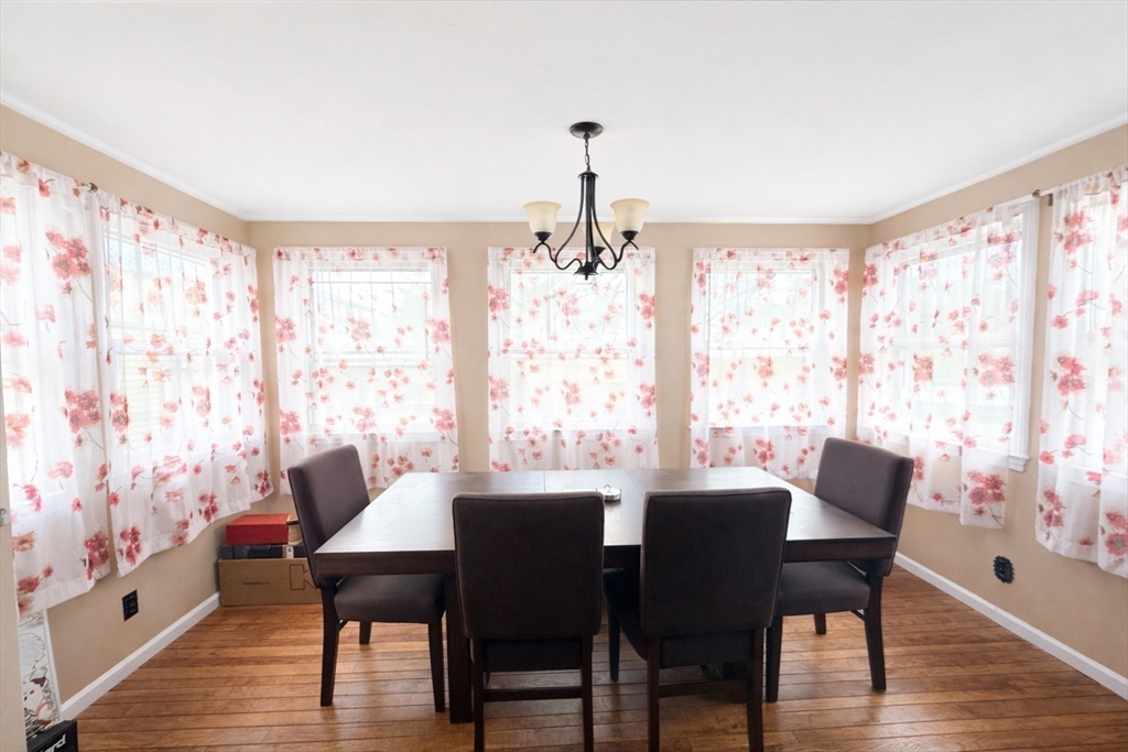 83 Gilman Street Springfield, MA 01118 - Photo 6 of 11 a dining room with furniture and wooden floor