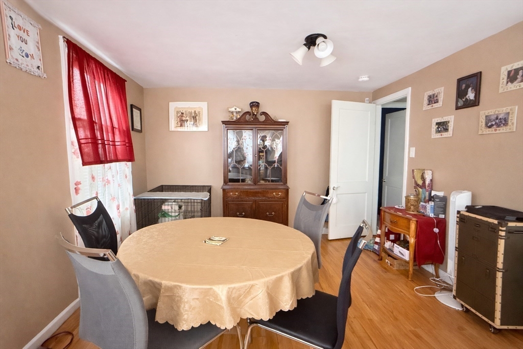 83 Gilman Street Springfield, MA 01118 - Photo 7 of 11 a dining room with furniture and window