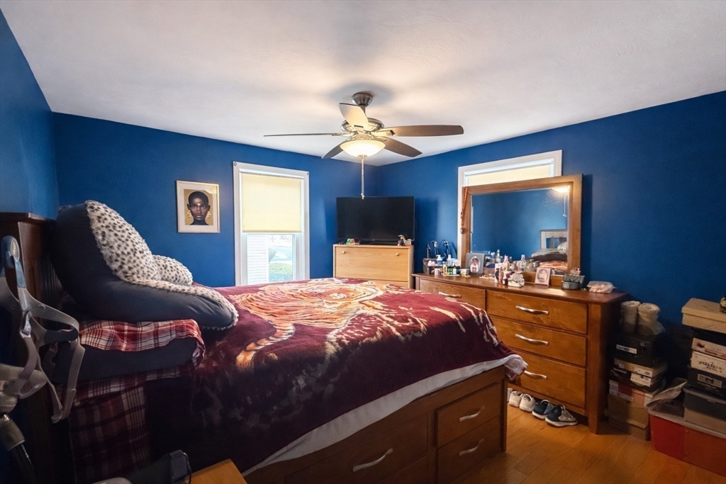 83 Gilman Street Springfield, MA 01118 - Photo 8 of 11 a bedroom with bed and window