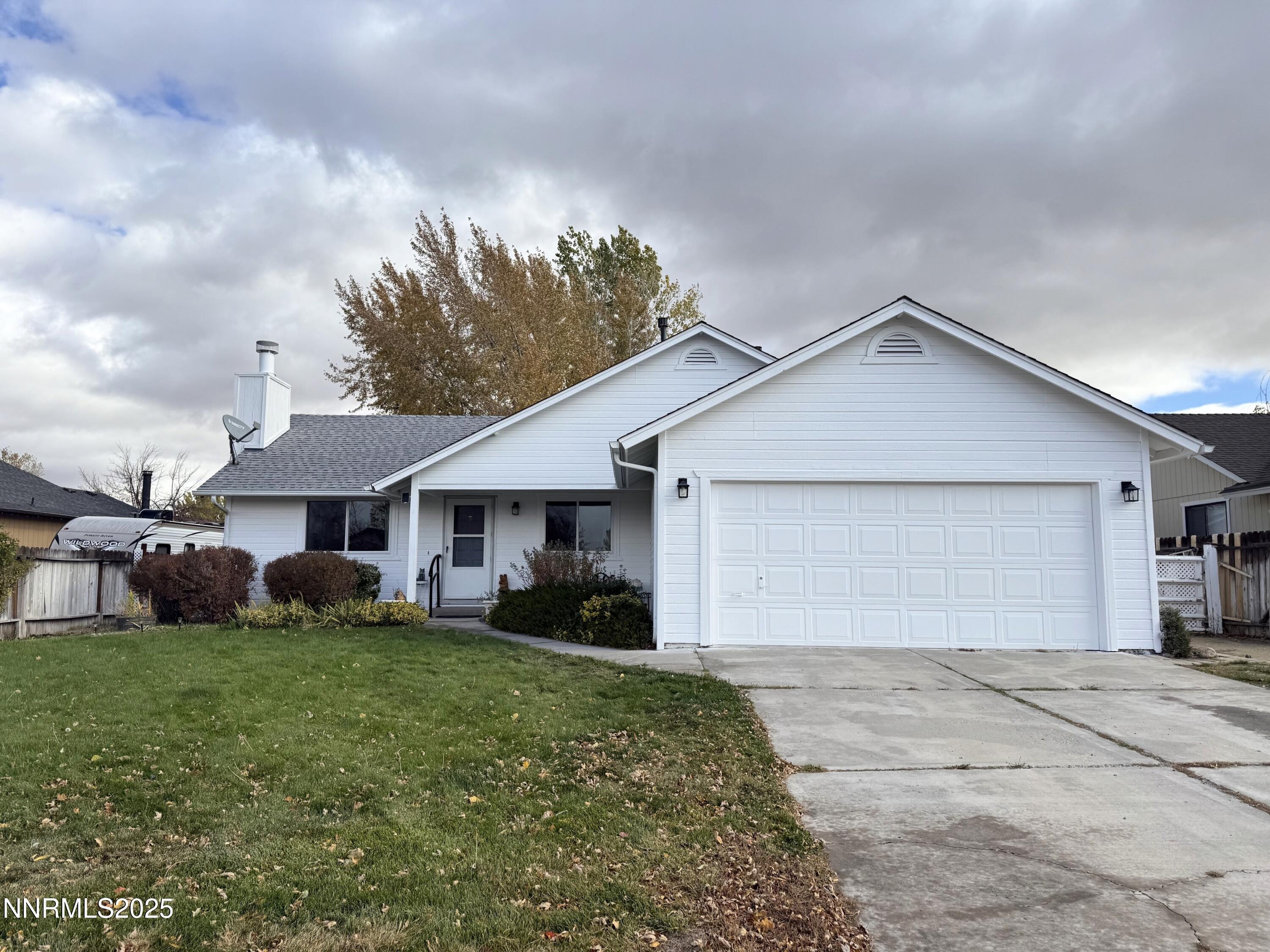 1348 Leonard Road Gardnerville, NV 89460 - Photo 1 of 13 a front view of house with yard and green space