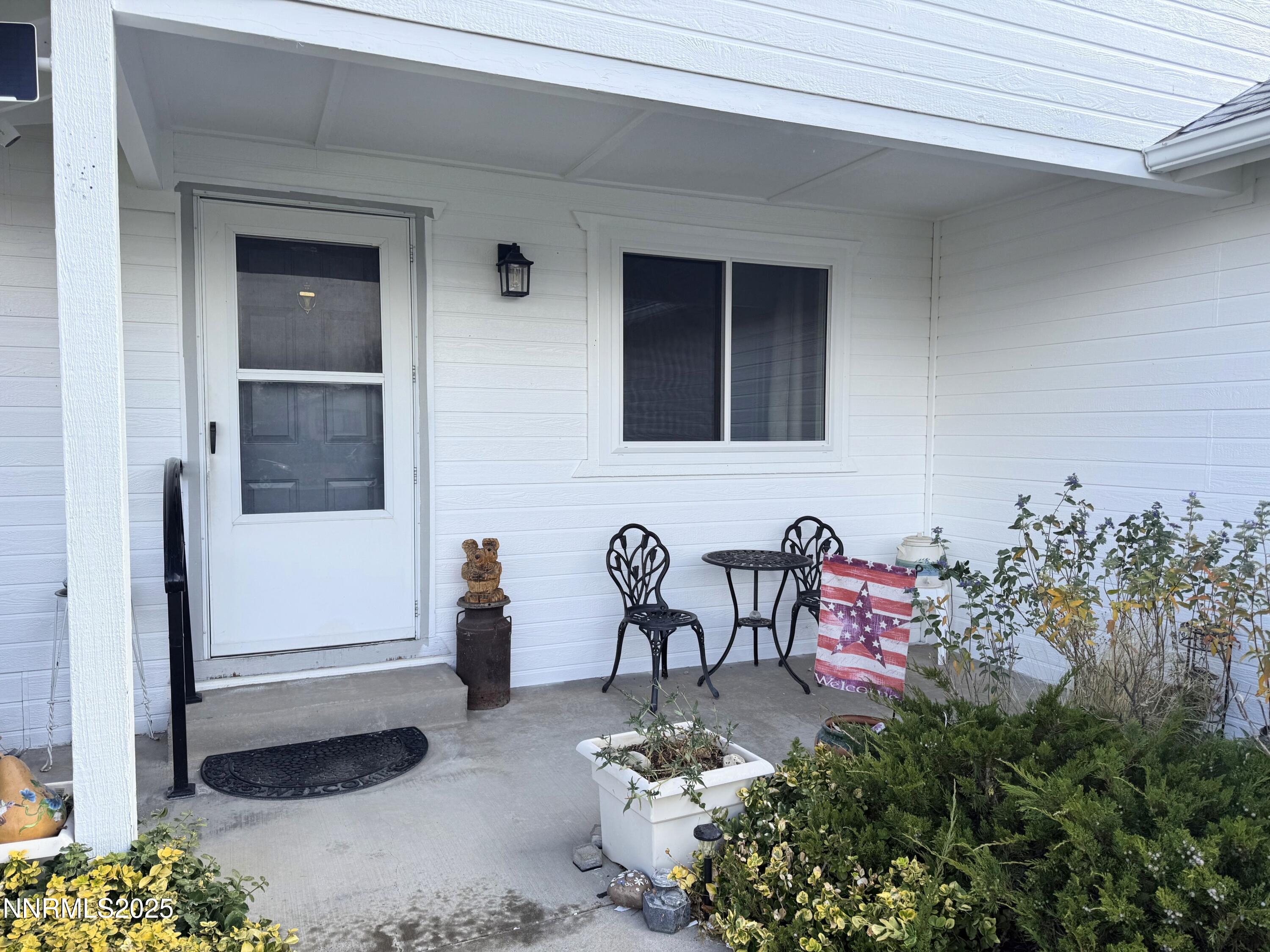 1348 Leonard Road Gardnerville, NV 89460 - Photo 2 of 13 a front view of a house with outdoor seating