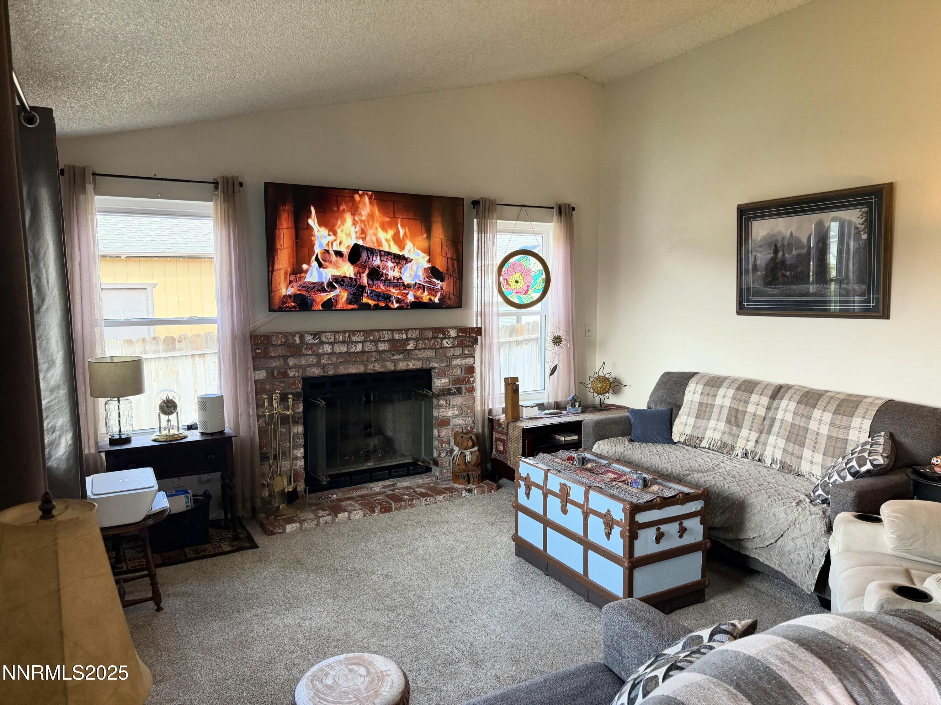 1348 Leonard Road Gardnerville, NV 89460 - Photo 3 of 13 a living room with furniture and a fireplace