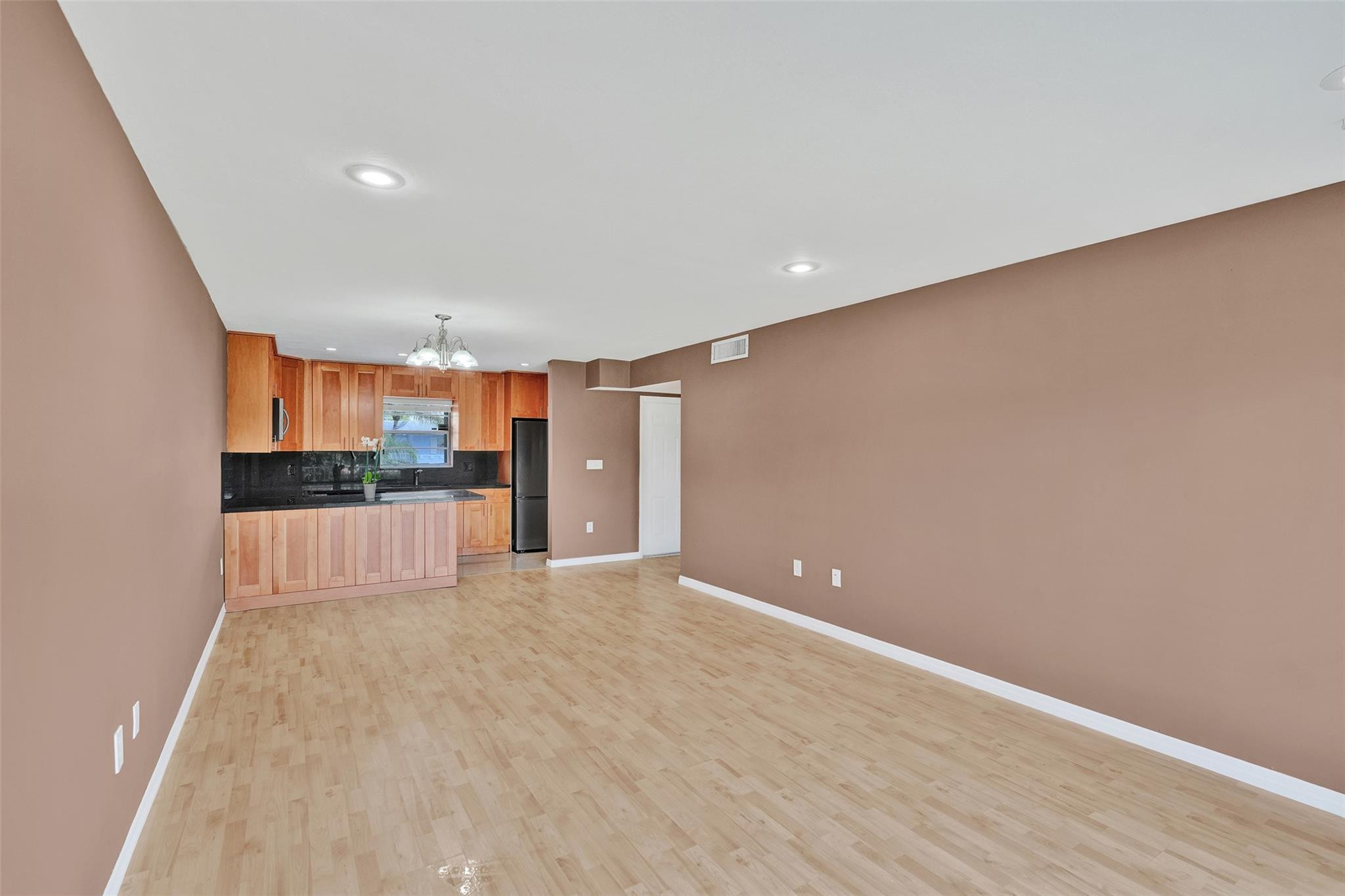 7580 Southwest 82nd Street Miami, FL 33143 - Photo 11 of 23 a view of kitchen and wooden floor