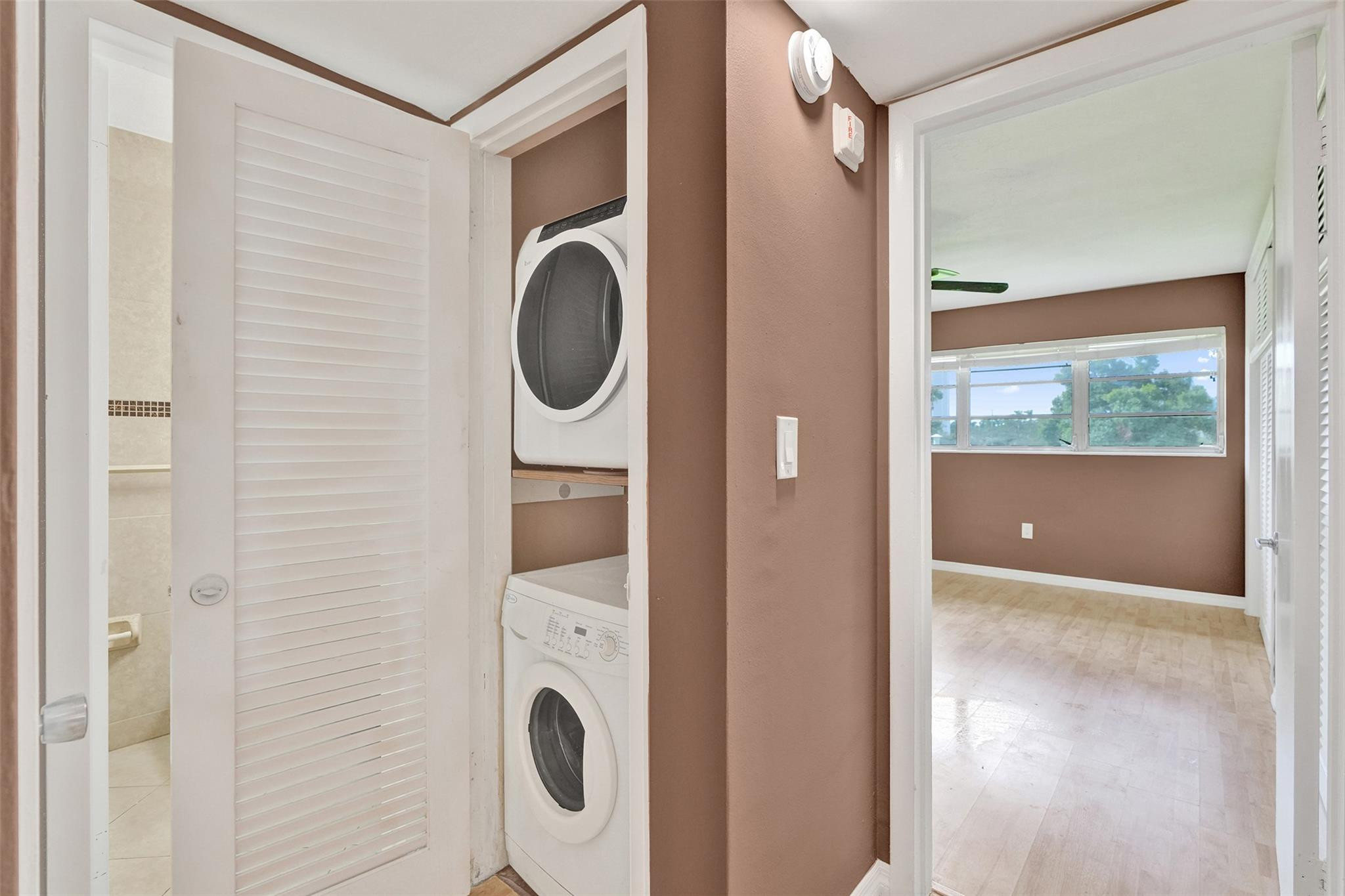 7580 Southwest 82nd Street Miami, FL 33143 - Photo 12 of 23 a view of a hallway with washer and dryer