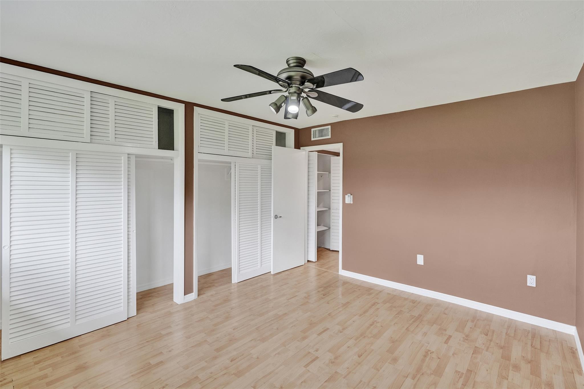 7580 Southwest 82nd Street Miami, FL 33143 - Photo 19 of 23 a view of a livingroom with a chandelier fan and wooden floor
