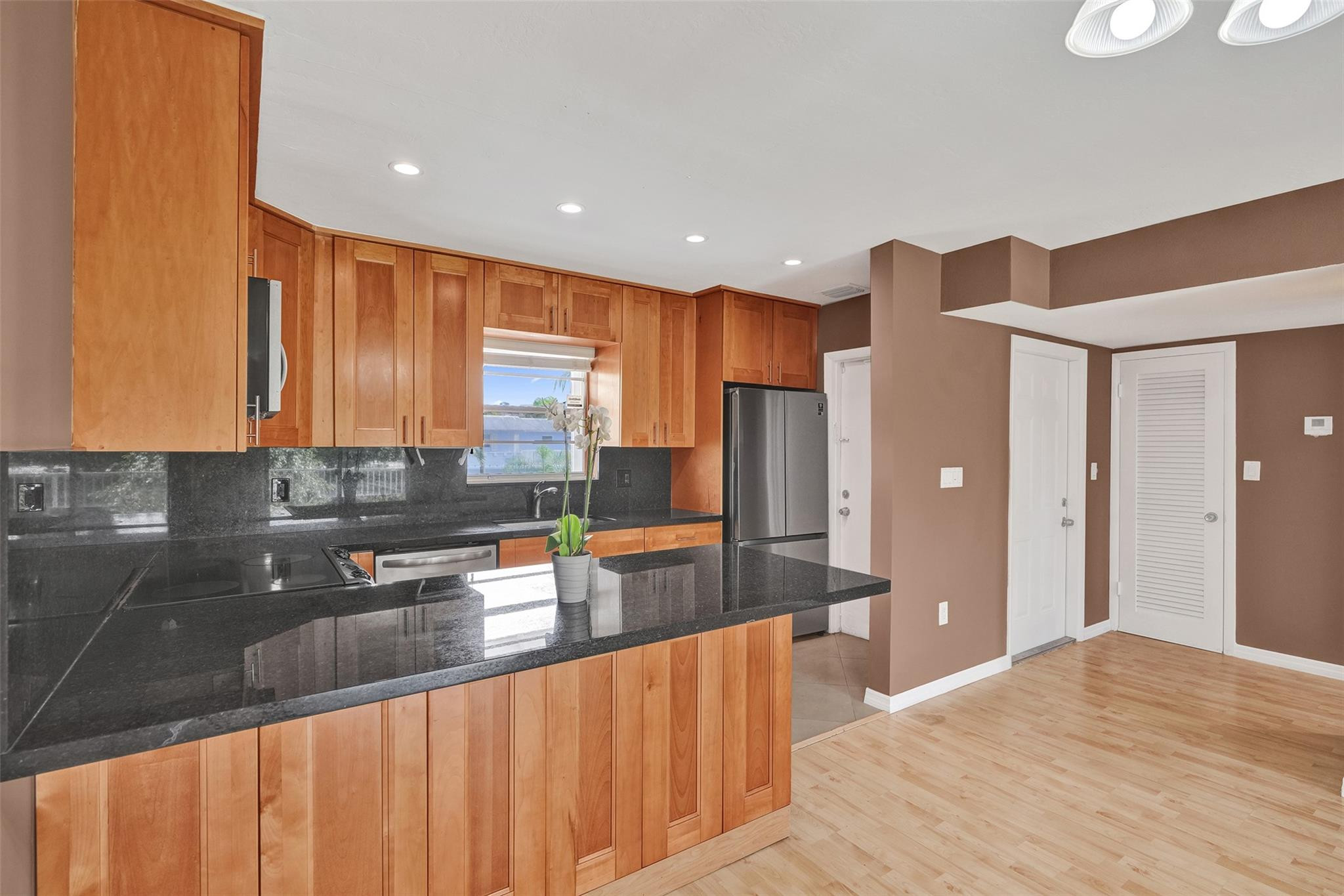 7580 Southwest 82nd Street Miami, FL 33143 - Photo 2 of 23 a kitchen with stainless steel appliances granite countertop a refrigerator and a sink