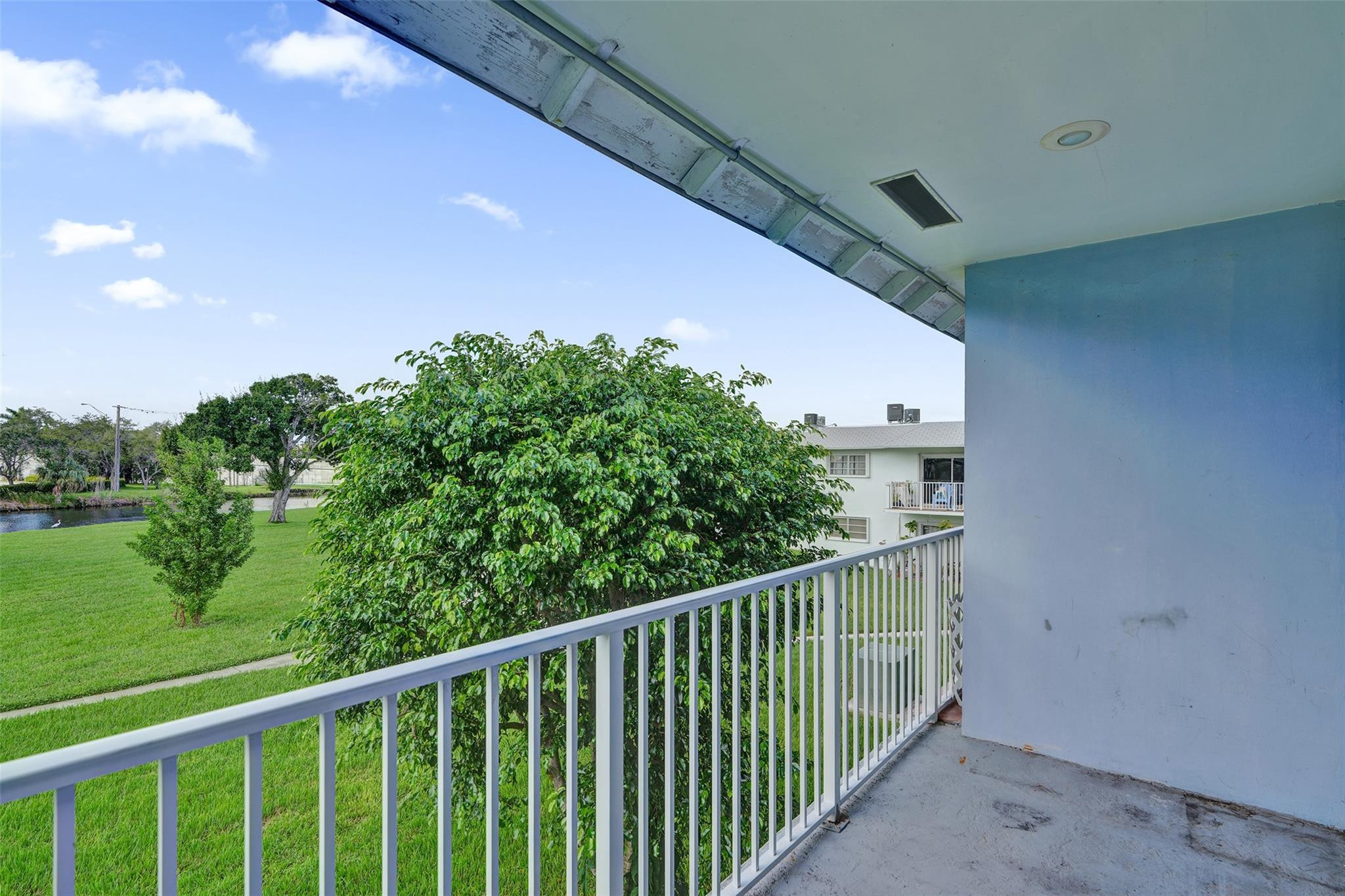 7580 Southwest 82nd Street Miami, FL 33143 - Photo 21 of 23 a balcony with trees in front of it