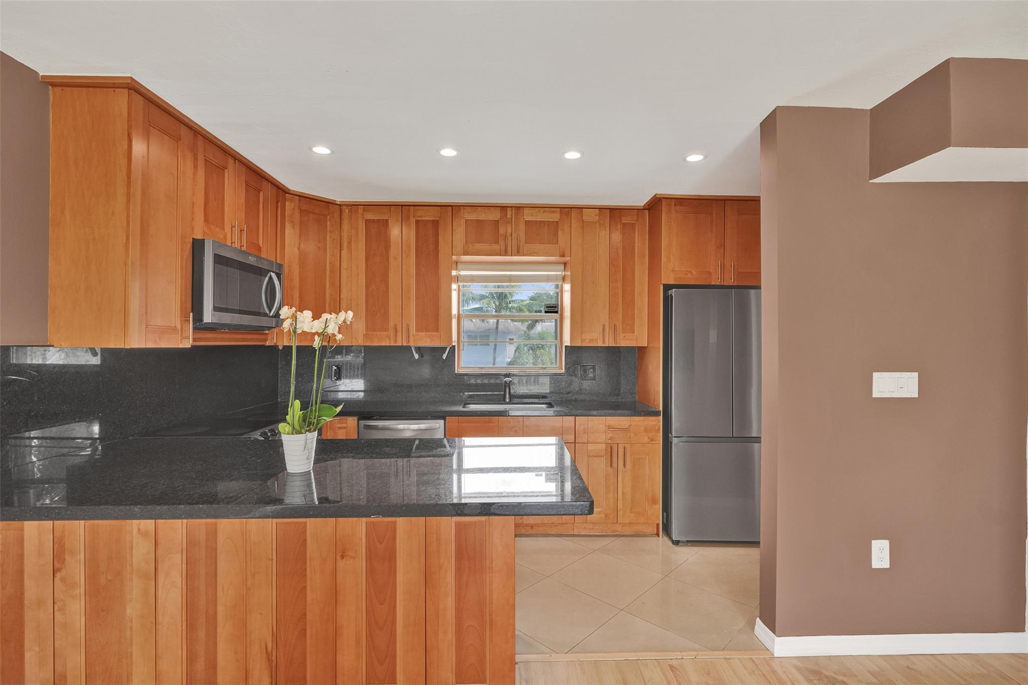 7580 Southwest 82nd Street Miami, FL 33143 - Photo 5 of 23 a kitchen with stainless steel appliances granite countertop a refrigerator and a sink