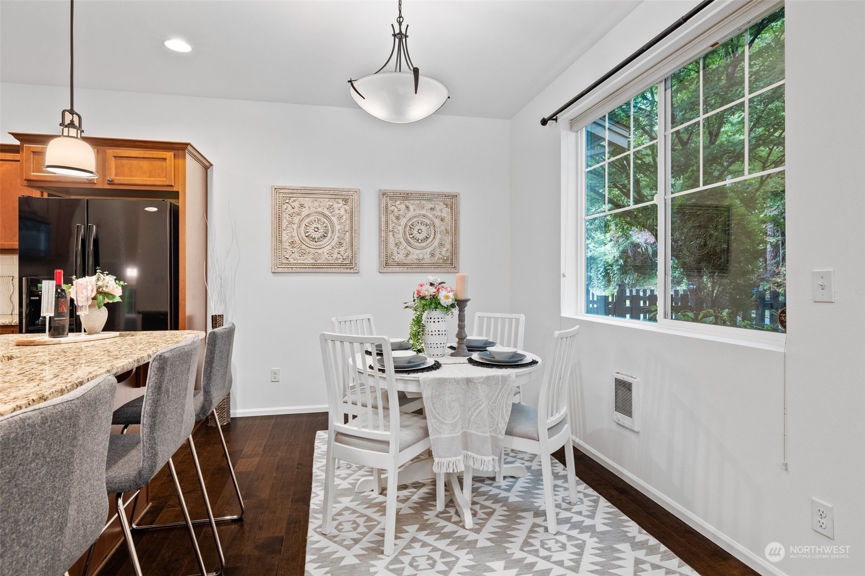 10715 Ross Road, Unit B Bothell, WA 98011 - Photo 11 of 21 a view of a dining room with furniture window and outside view