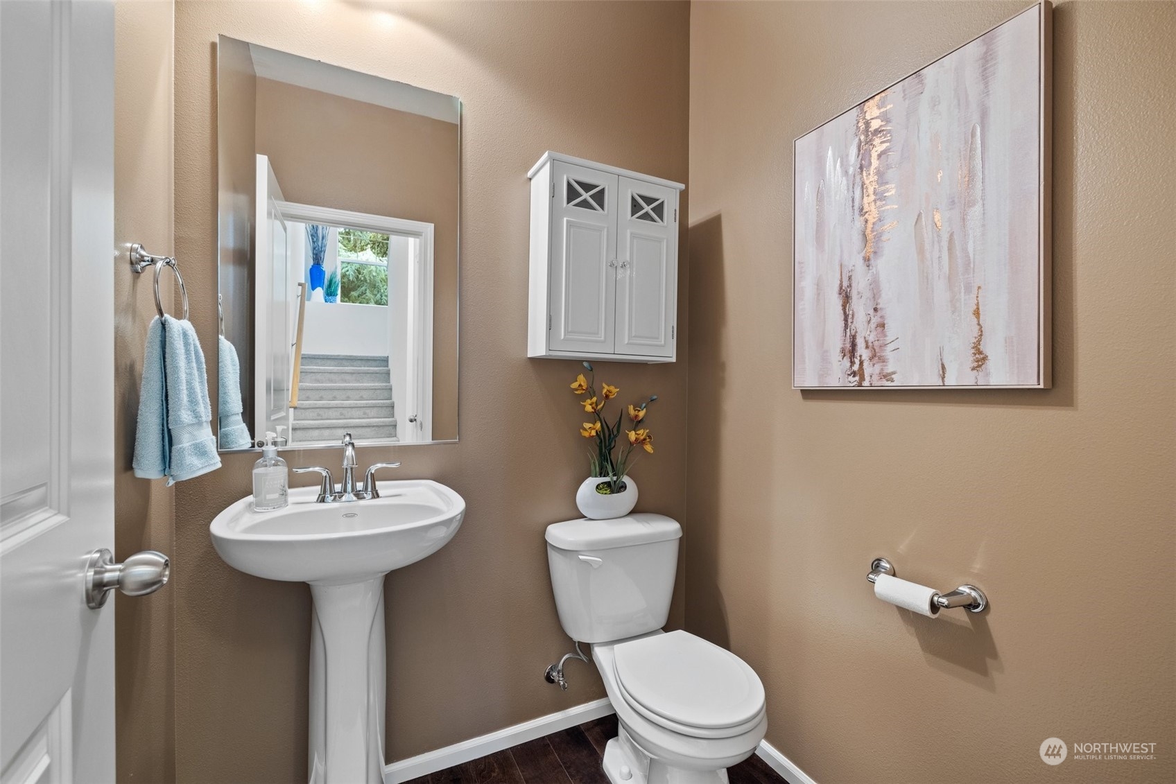 10715 Ross Road, Unit B Bothell, WA 98011 - Photo 12 of 21 a bathroom with a toilet sink and mirror