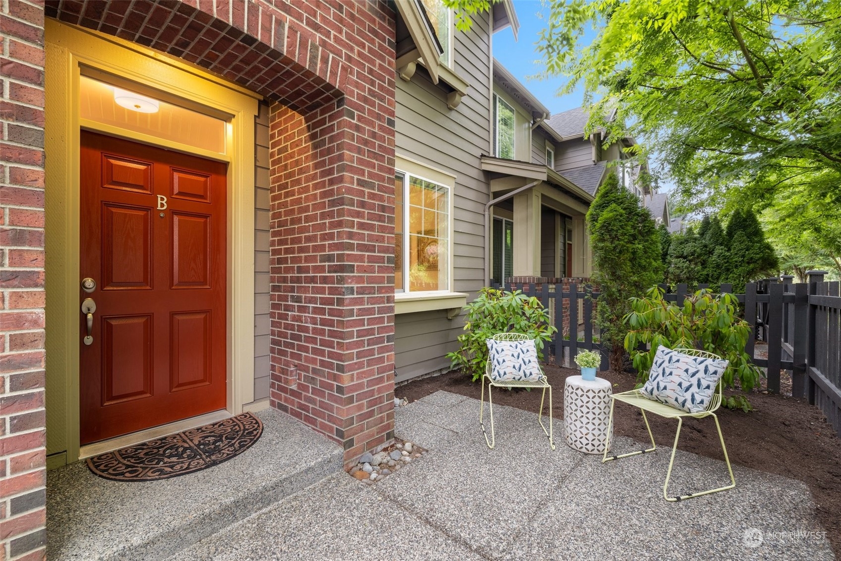 10715 Ross Road, Unit B Bothell, WA 98011 - Photo 3 of 21 a view of a door and chair and table in the porch