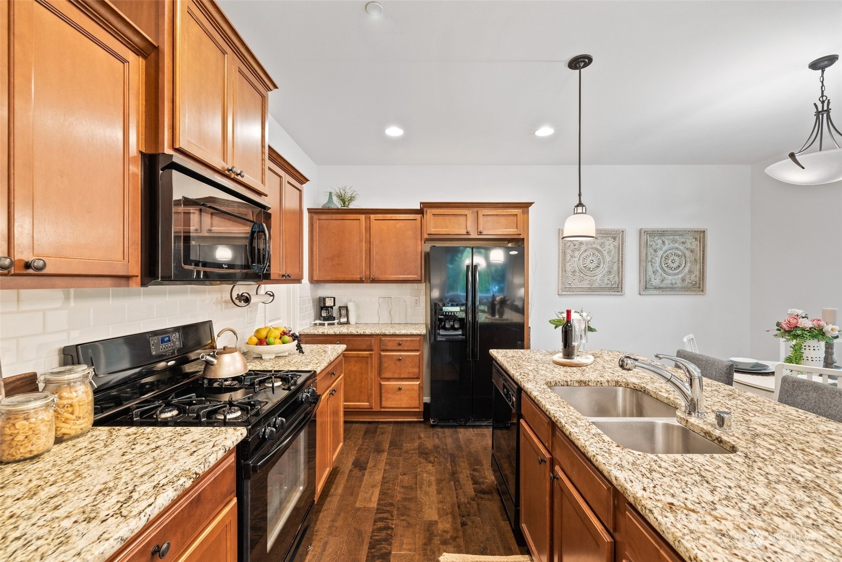 10715 Ross Road, Unit B Bothell, WA 98011 - Photo 9 of 21 a kitchen with stainless steel appliances granite countertop a sink stove and refrigerator