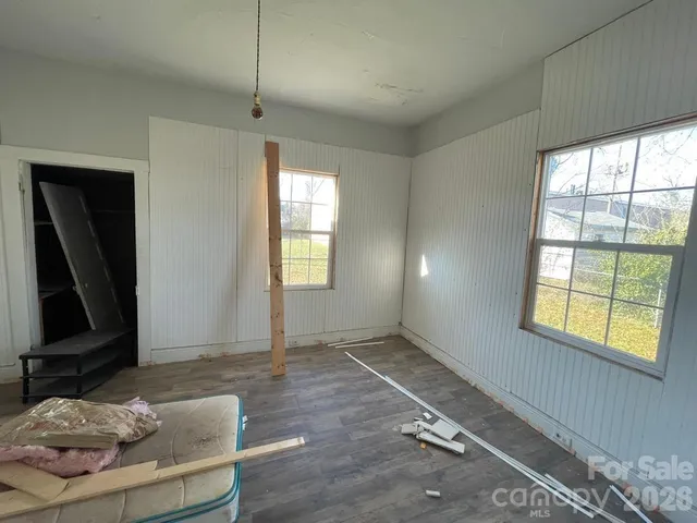 a kitchen with granite countertop a sink stove and refrigerator