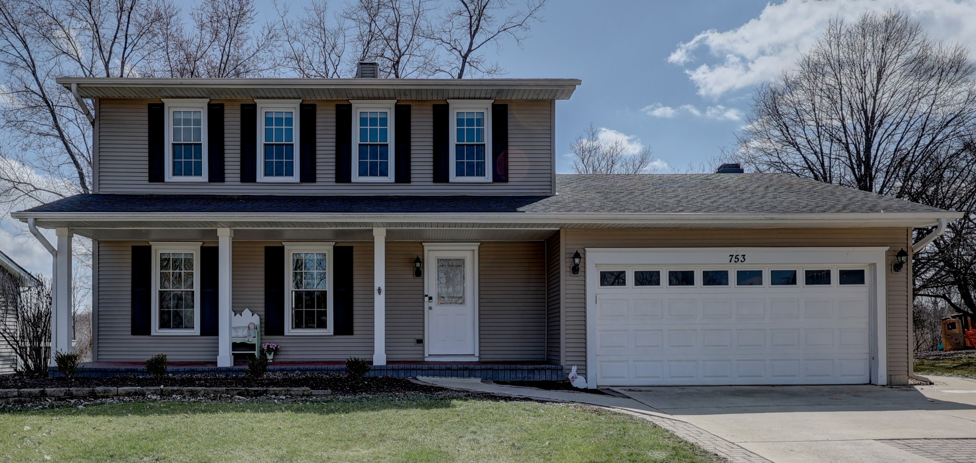 a front view of a house with a yard