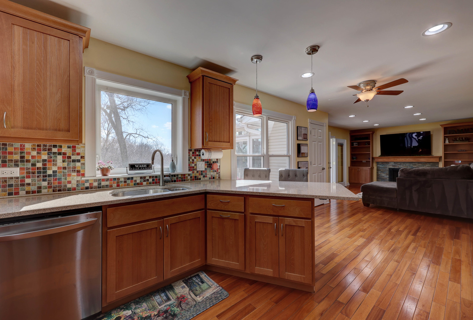 753 Holly Drive Bartlett, IL 60103 - Photo 14 of 43 a kitchen with stainless steel appliances granite countertop wooden cabinets a sink dishwasher a stove and a refrigerator with wooden floor