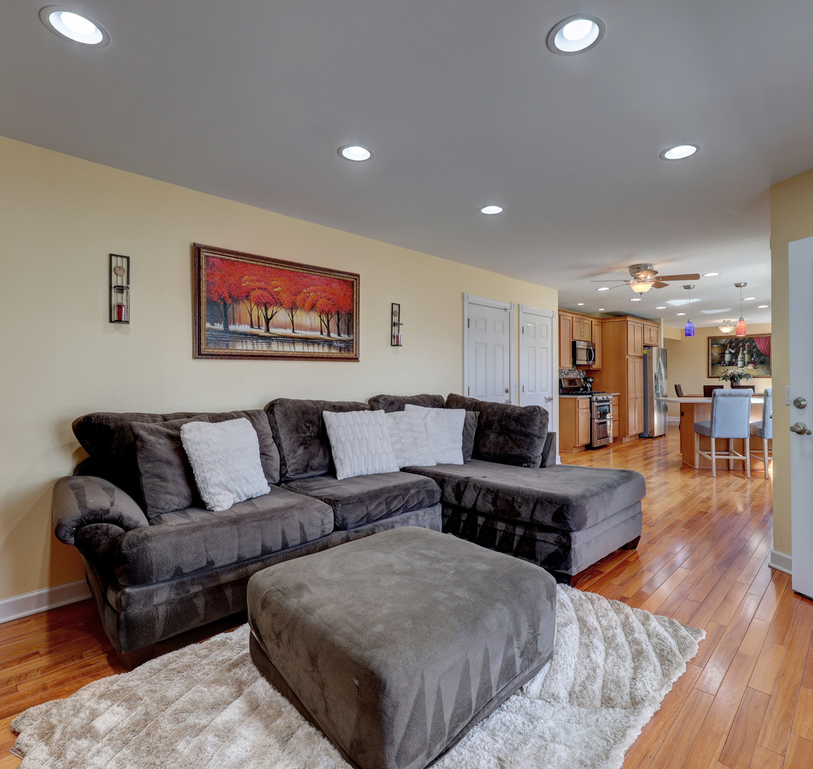 753 Holly Drive Bartlett, IL 60103 - Photo 17 of 43 a living room with furniture and a flat screen tv