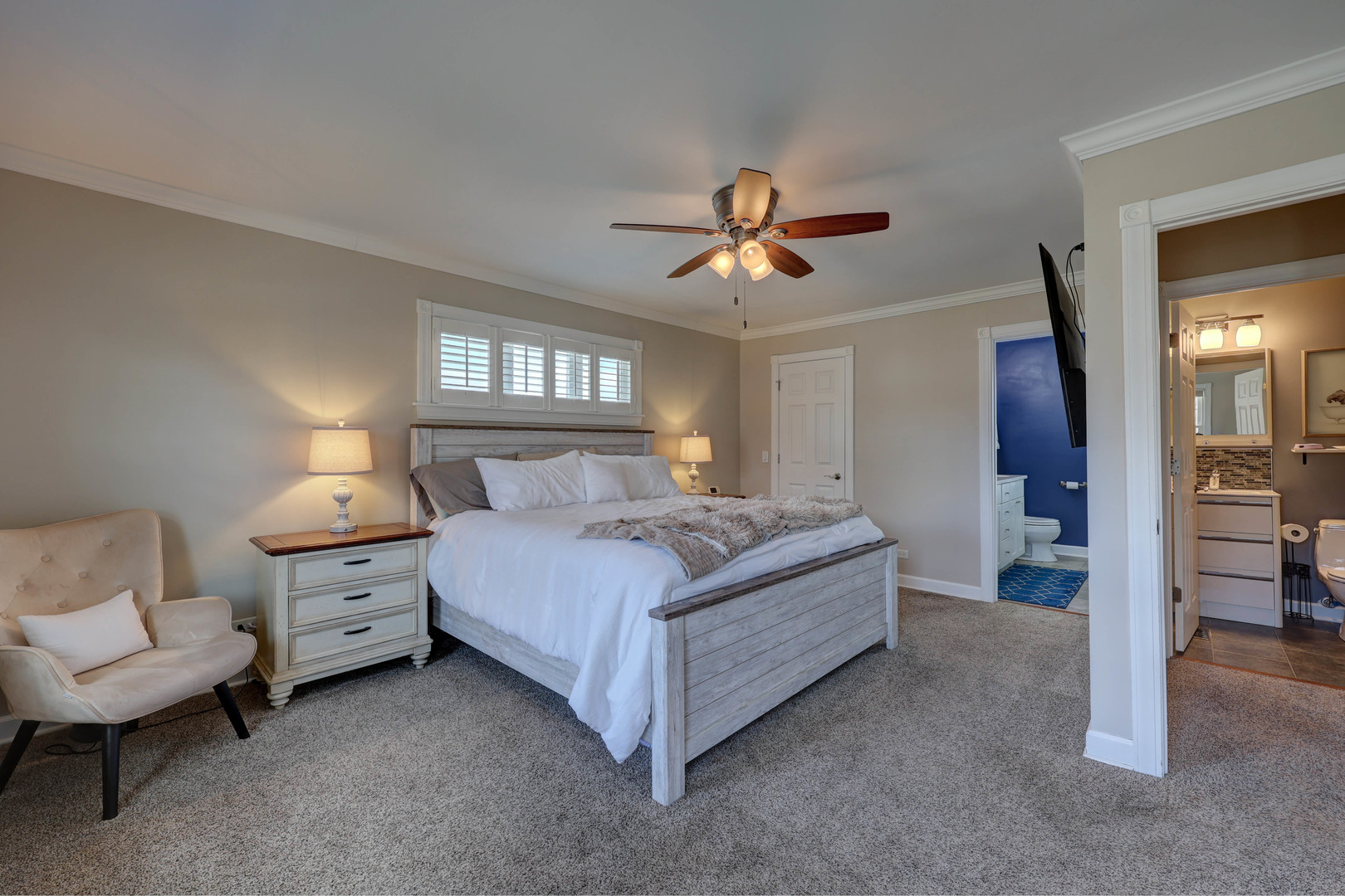 753 Holly Drive Bartlett, IL 60103 - Photo 27 of 43 a spacious bedroom with a bed and a chandelier