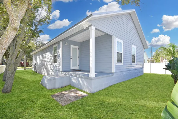 a backyard of a house with seating space