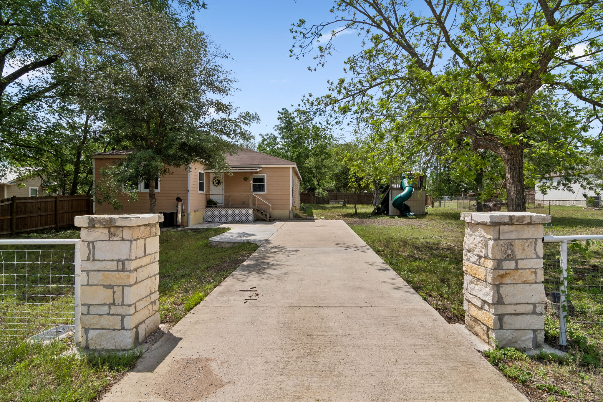 810 Lamar Street Luling, TX 78648 - Photo 1 of 21 a view of a house with a backyard