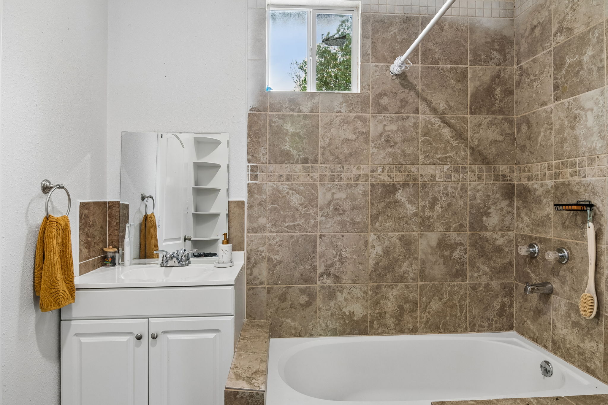 810 Lamar Street Luling, TX 78648 - Photo 11 of 21 a bathroom with a sink and a bathtub