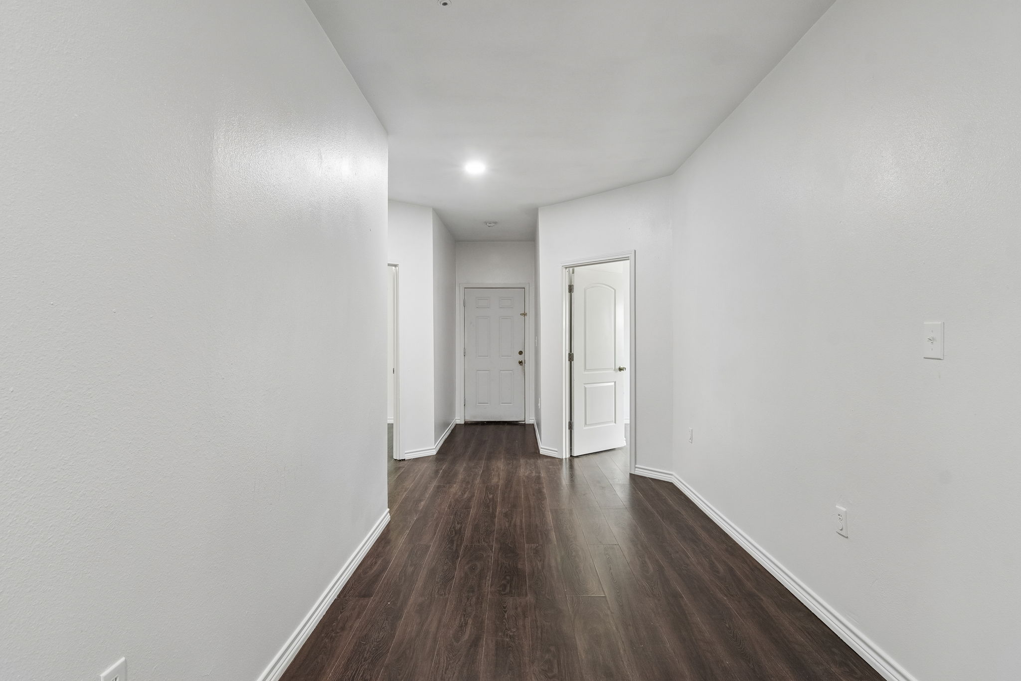 810 Lamar Street Luling, TX 78648 - Photo 13 of 21 a view of a hallway with wooden floor