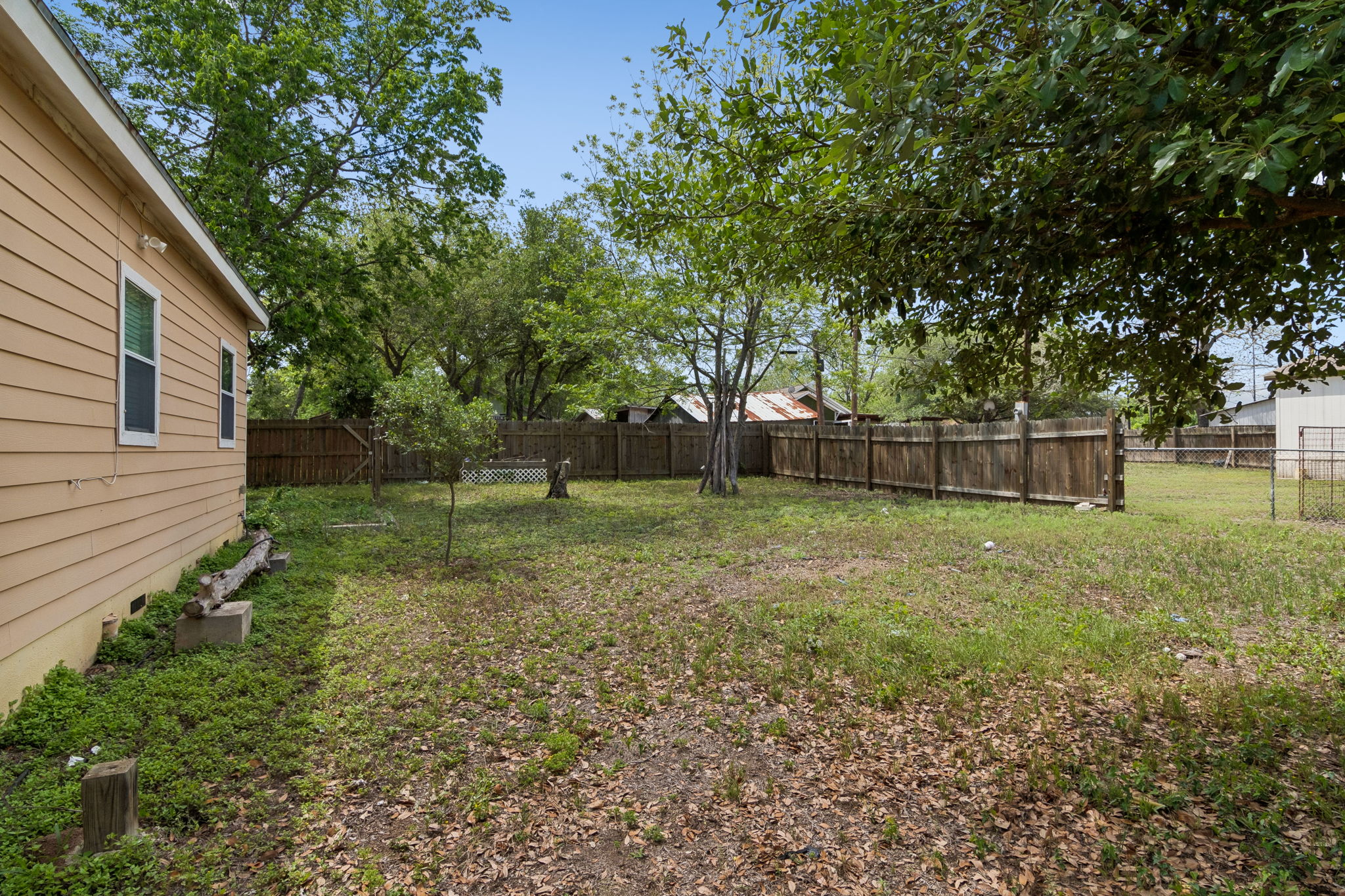 810 Lamar Street Luling, TX 78648 - Photo 19 of 21 a backyard of a house with lots of green space