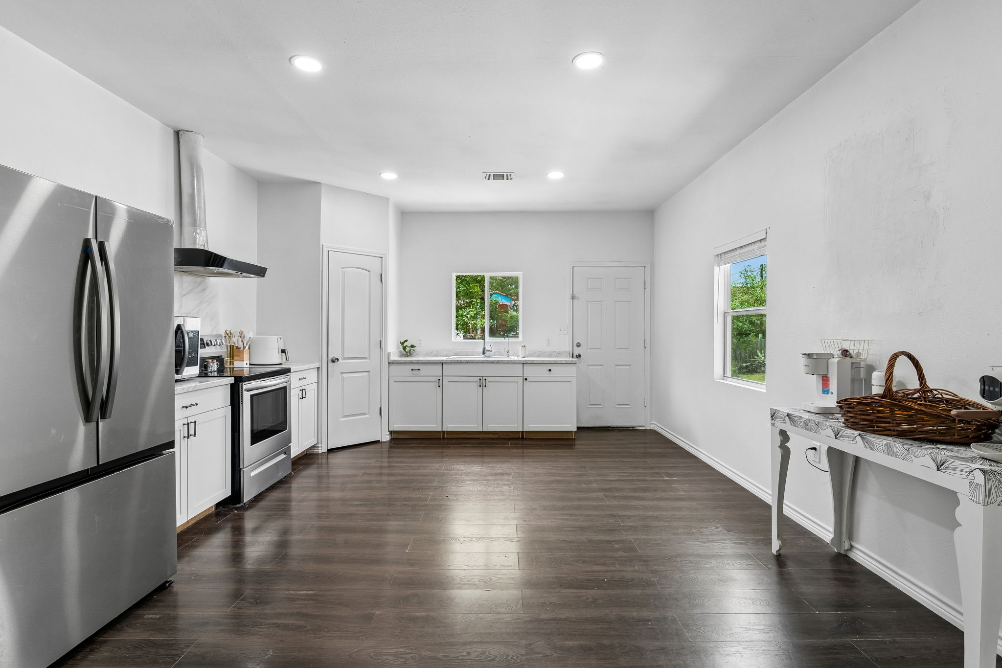 810 Lamar Street Luling, TX 78648 - Photo 7 of 21 a kitchen with a refrigerator and a stove top oven