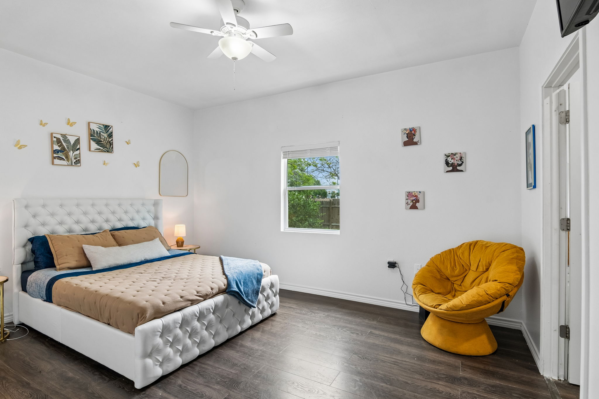 810 Lamar Street Luling, TX 78648 - Photo 9 of 21 a bedroom with a bed and window