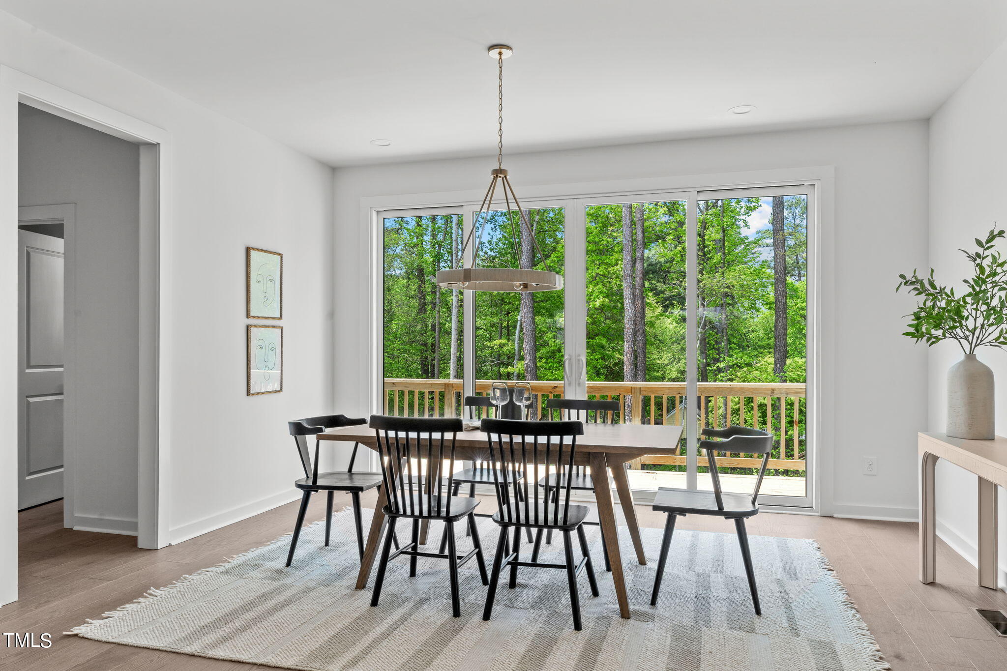 6405 Tanner Oak Lane Raleigh, NC 27613 - Photo 9 of 49 a view of a dining room with furniture window and outside view