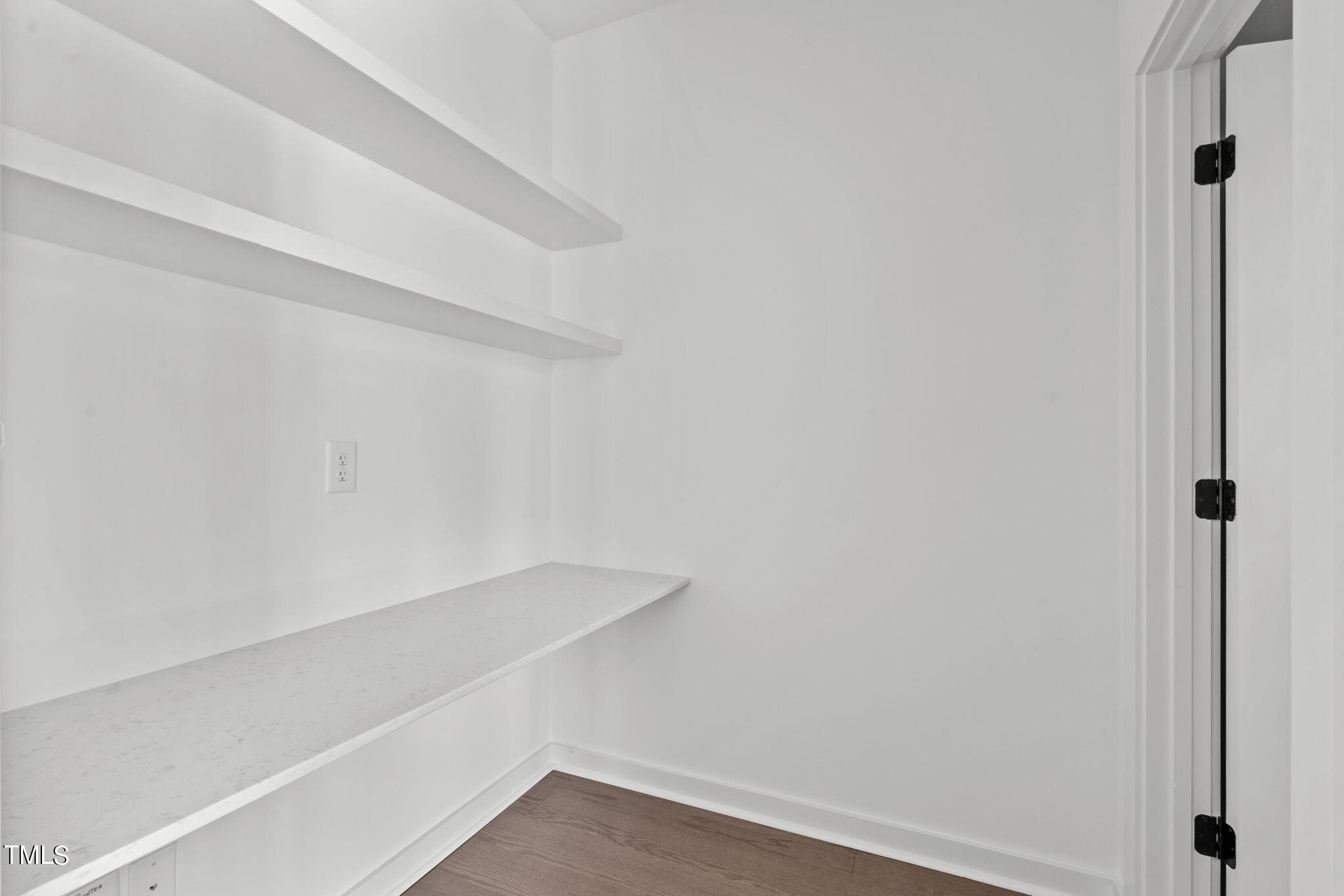 6405 Tanner Oak Lane Raleigh, NC 27613 - Photo 10 of 49 a view of small space with racks on the wall