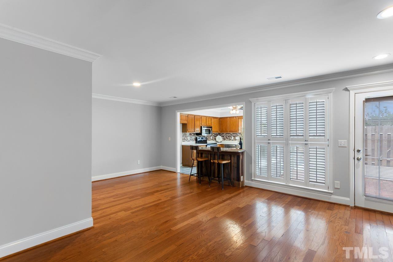 6903 Saxby Court Raleigh, NC 27613 - Photo 2 of 11 The family space boasts hardwood floors, fresh paint, canned lights and plantation shutters.