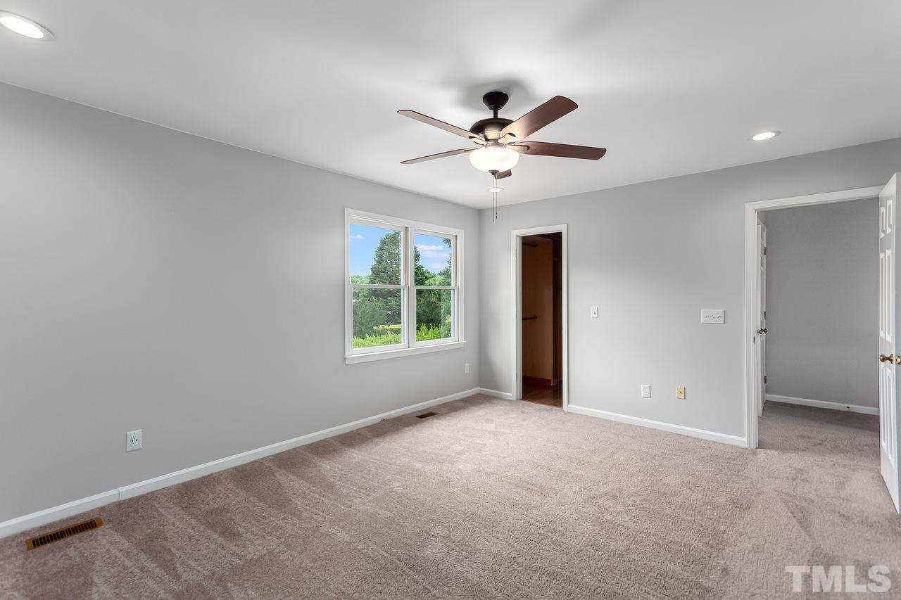6903 Saxby Court Raleigh, NC 27613 - Photo 8 of 11 Hard to see in this photo, but the master has a custom walk-on closet like no other!