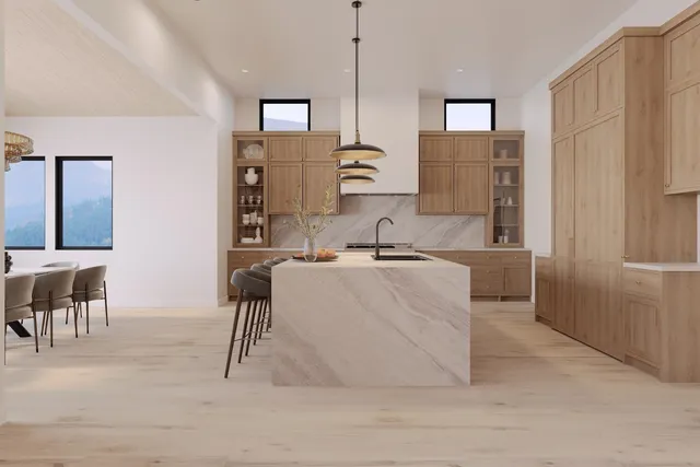a living room with stainless steel appliances kitchen island granite countertop furniture and a fireplace