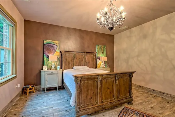 a bedroom with furniture and a ceiling fan