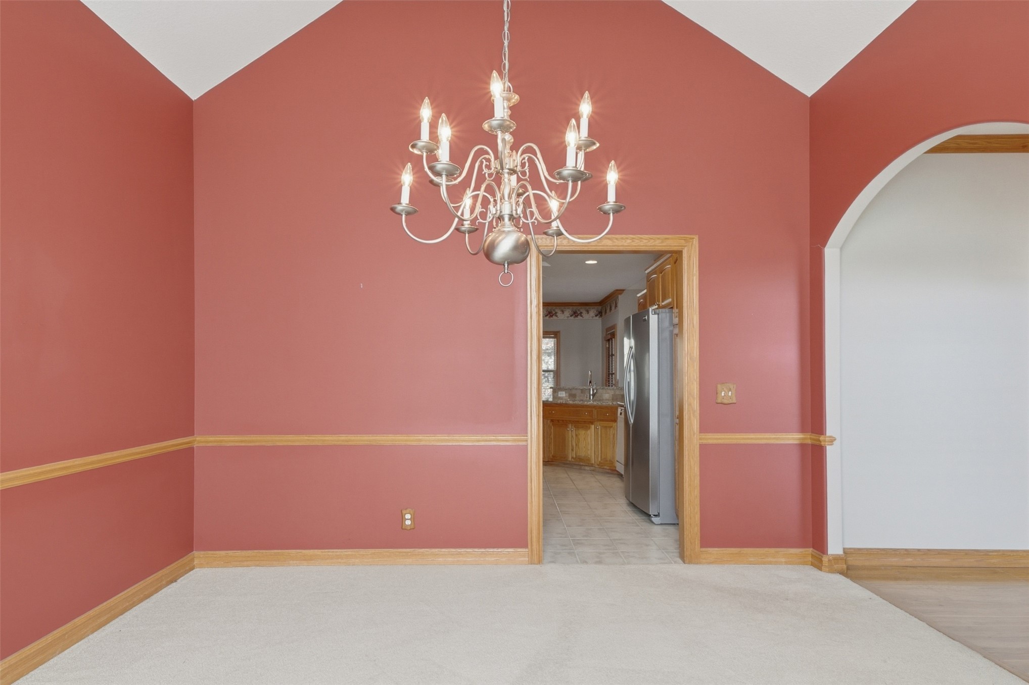 17875 East 589 Road Inola, OK 74036 - Photo 12 of 73 Vaulted ceilings, a candelabra-style chandelier, and chair rail molding