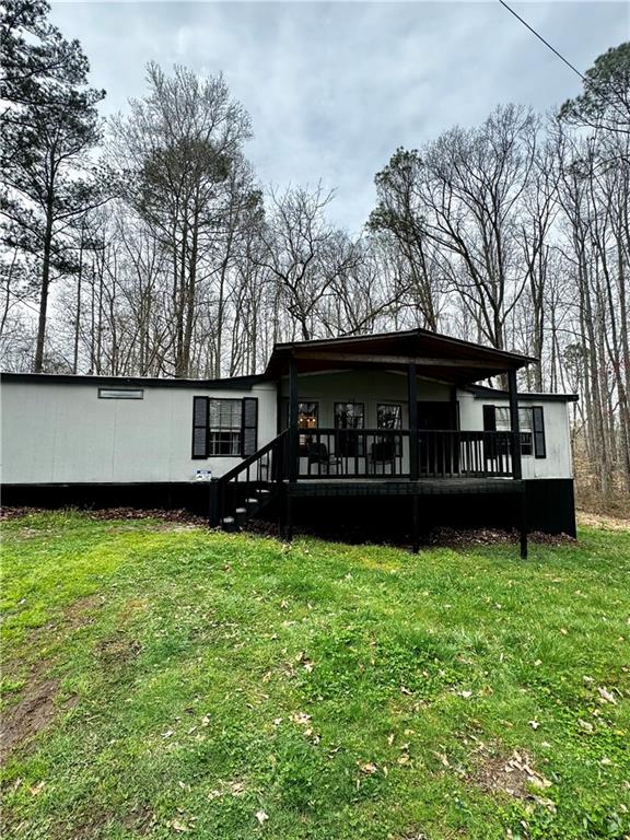 276 Perkins Road Dallas, GA 30157 - Photo 1 of 1 a view of a house with a yard