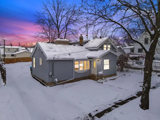 a view of a building with a snow in the yard