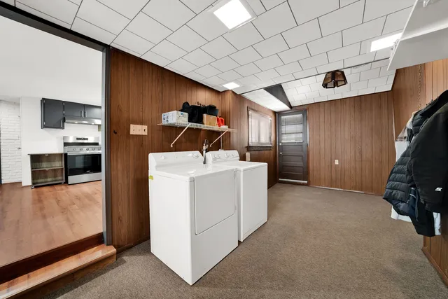 a bed room with a bed and a television