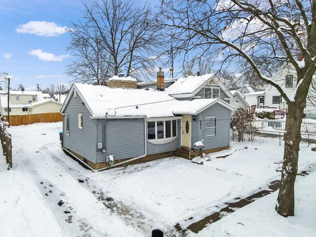 a view of a house with snow on the yard