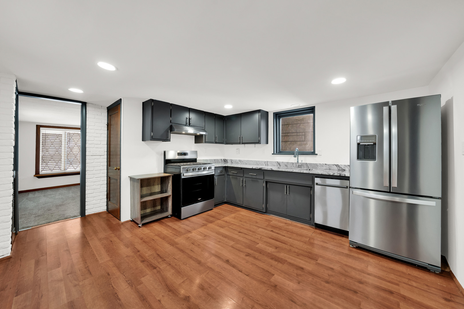 541 Charles Street Aurora, IL 60506 - Photo 6 of 38 a kitchen with stainless steel appliances granite countertop a refrigerator and a stove top oven