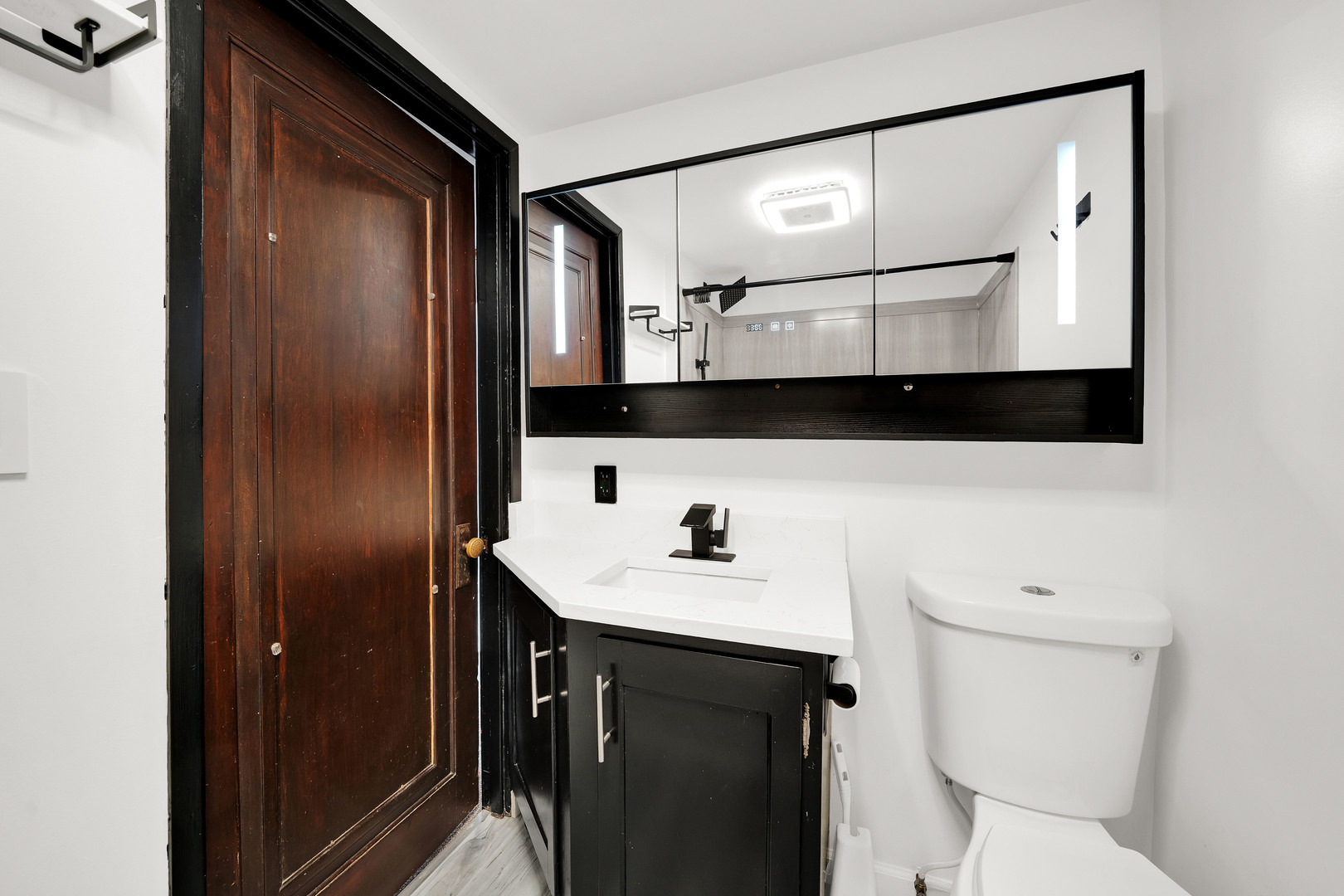 541 Charles Street Aurora, IL 60506 - Photo 10 of 38 a bathroom with a sink a toilet and mirror