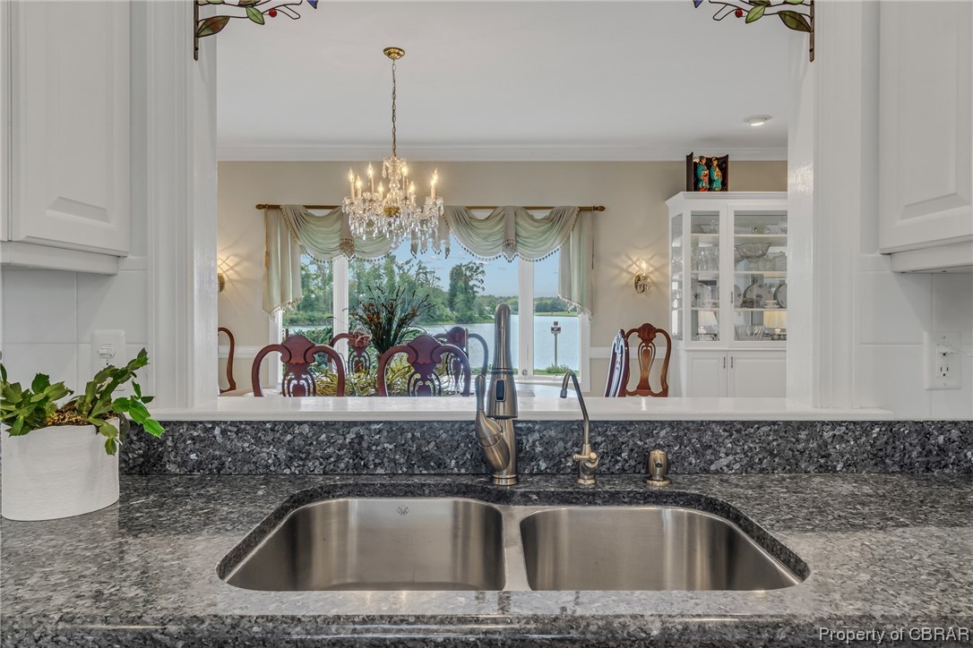 181 Duckbill Road White Stone, VA 22578 - Photo 22 of 50 Kitchen featuring a notable chandelier, ornamental molding, and dark stone counters