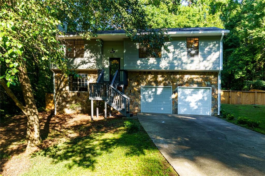 1172 Ridgeside Drive Northwest Acworth, GA 30102 - Photo 1 of 1 a front view of a house with a yard