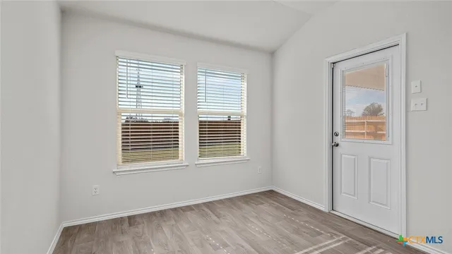 an empty room with windows