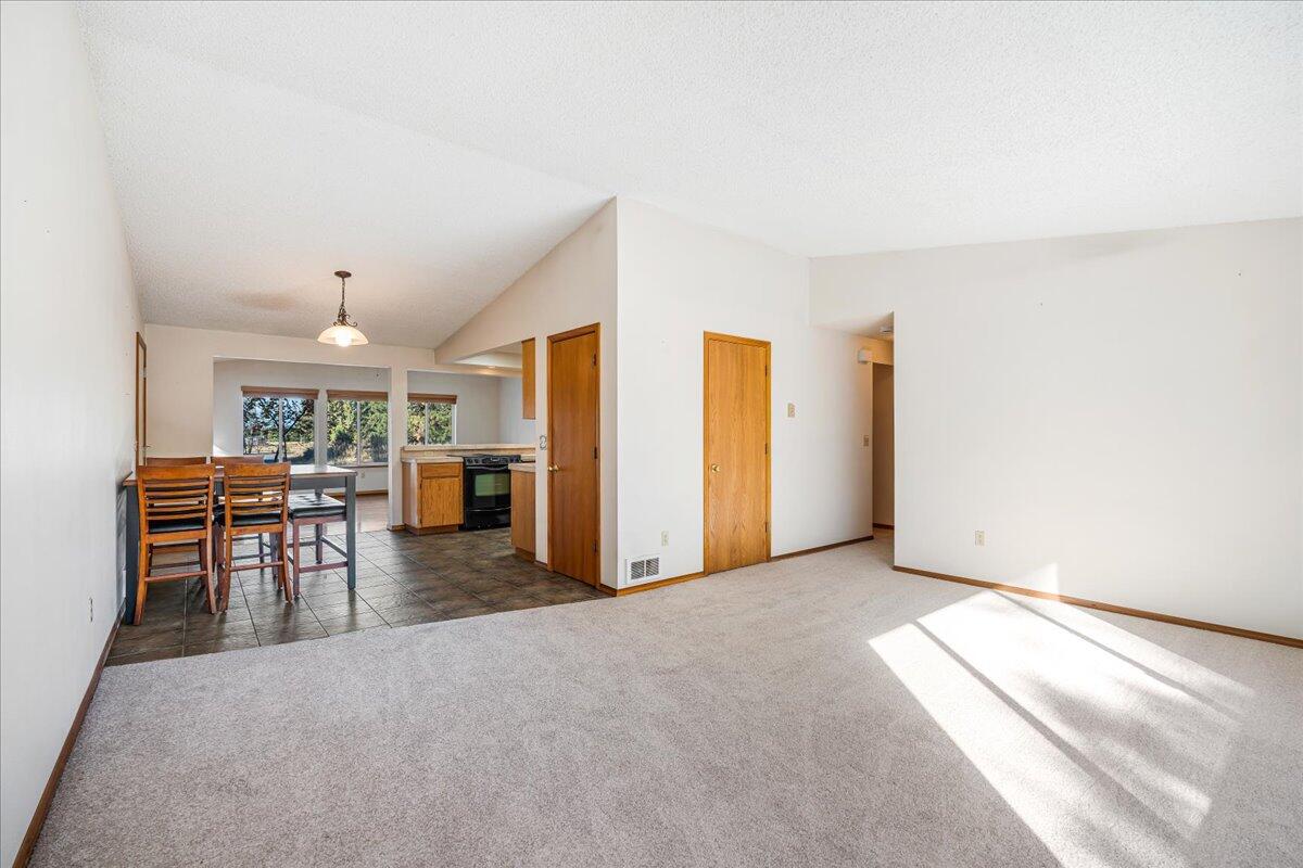 19304 Baker Road Bend, OR 97702 - Photo 2 of 38 Enter into your living room with new carpet and vaulted ceiling