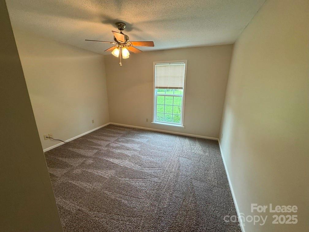 578 Wren Road Gastonia, NC 28056 - Photo 6 of 12 a view of an empty room with a window